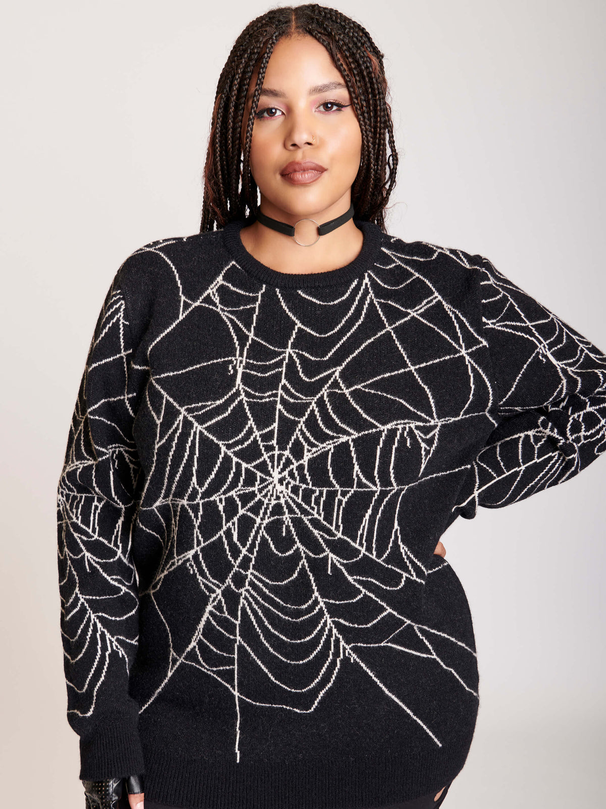 sweater with spiderweb motif on body and sleeves