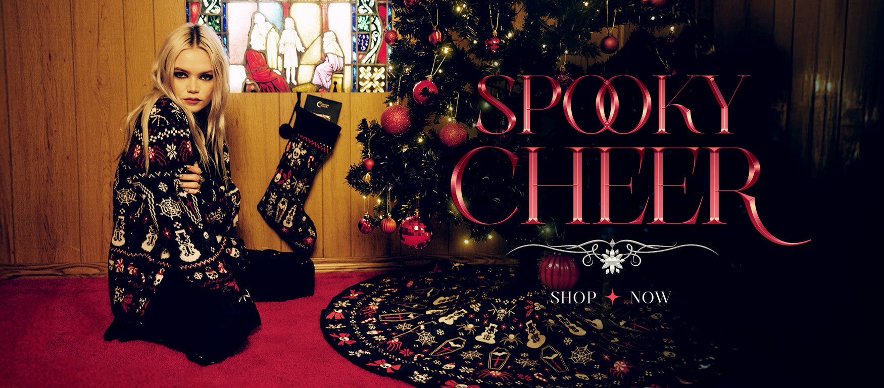 a christmas tree with ornaments and a stocking