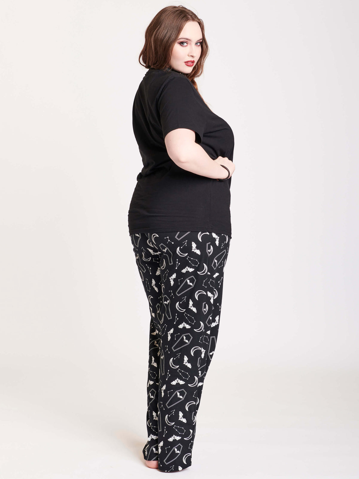 black t-shirt and sleep pants with coffin motif
