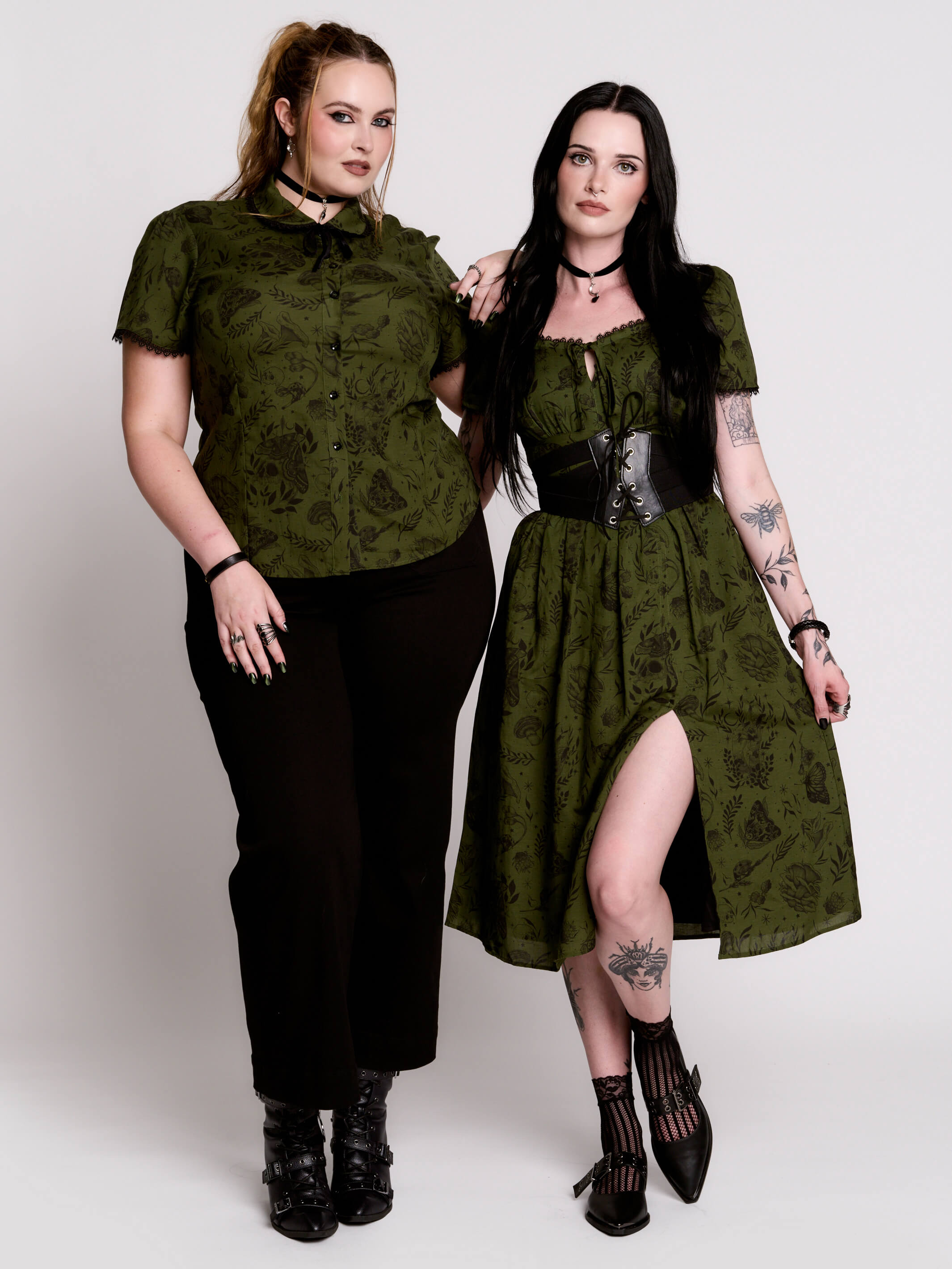 a short-sleeved olive green midi dress with a gothic pattern