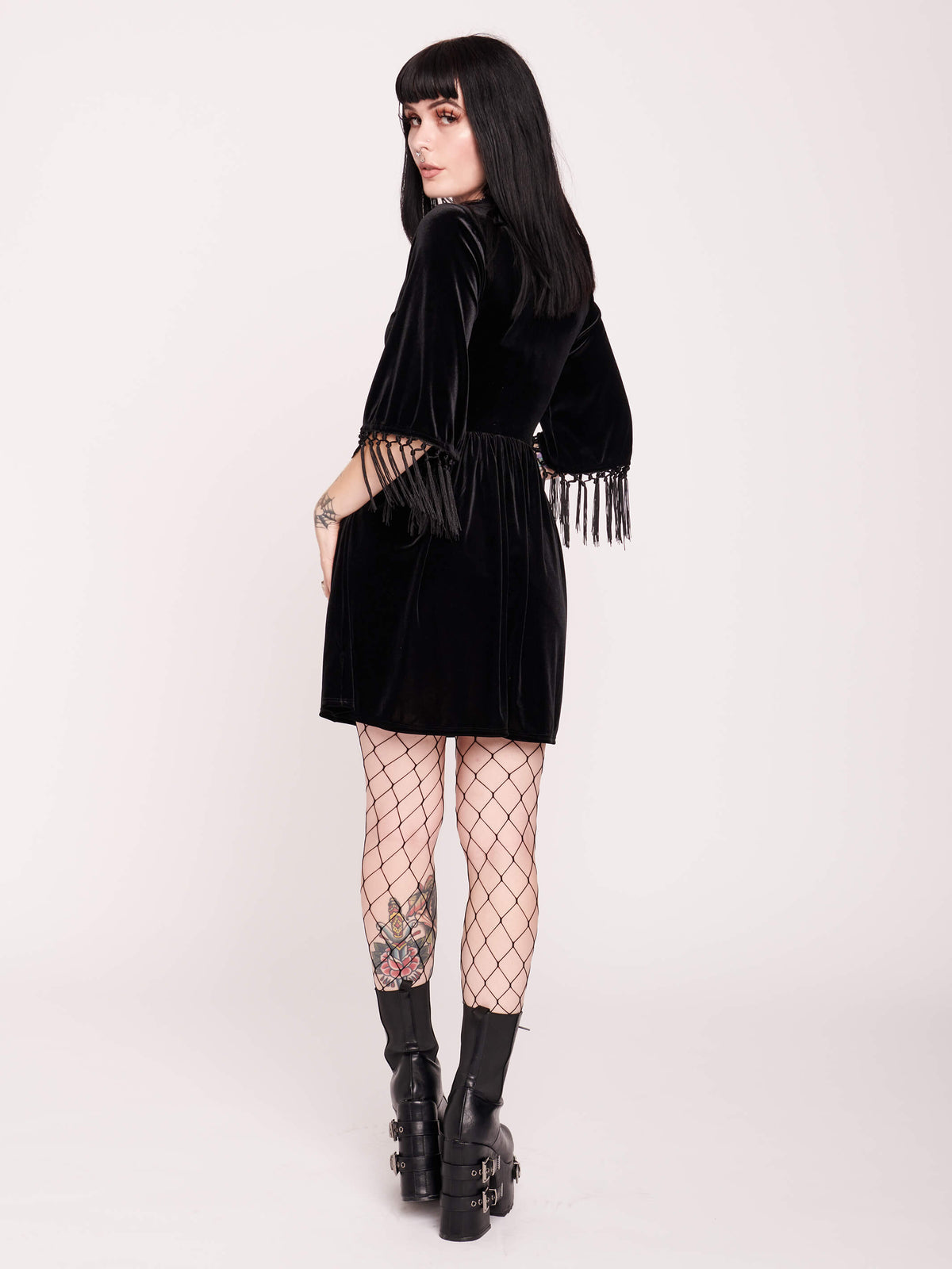 Good witch or bad witch? Day or evening? You decide when you wear our stretch velvet dress with fringe details on the sleeves. Stretch elastic at waist. Goth grunge fashion, alt girl fashion, goth clothing, gothic dress, black velvet dress, egirl fashion, emo fashion