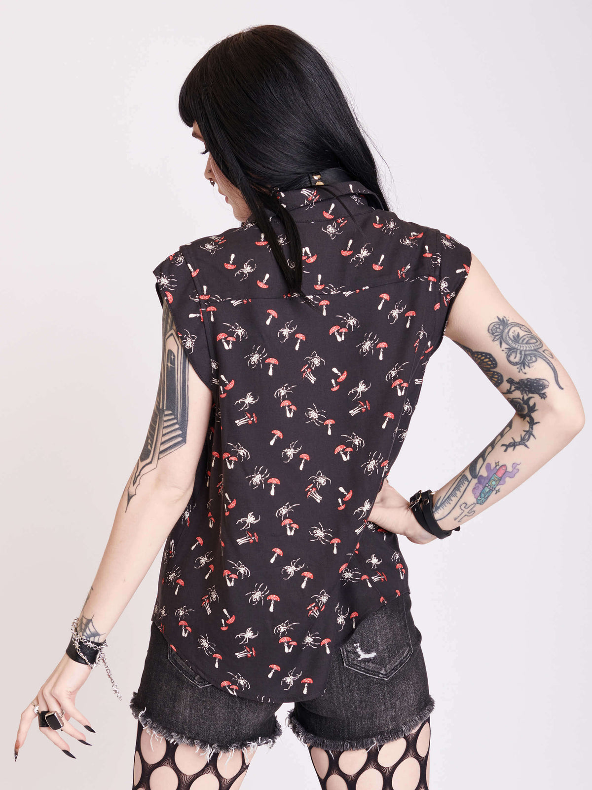 black sleevless button up top with scorpian and mushroom print