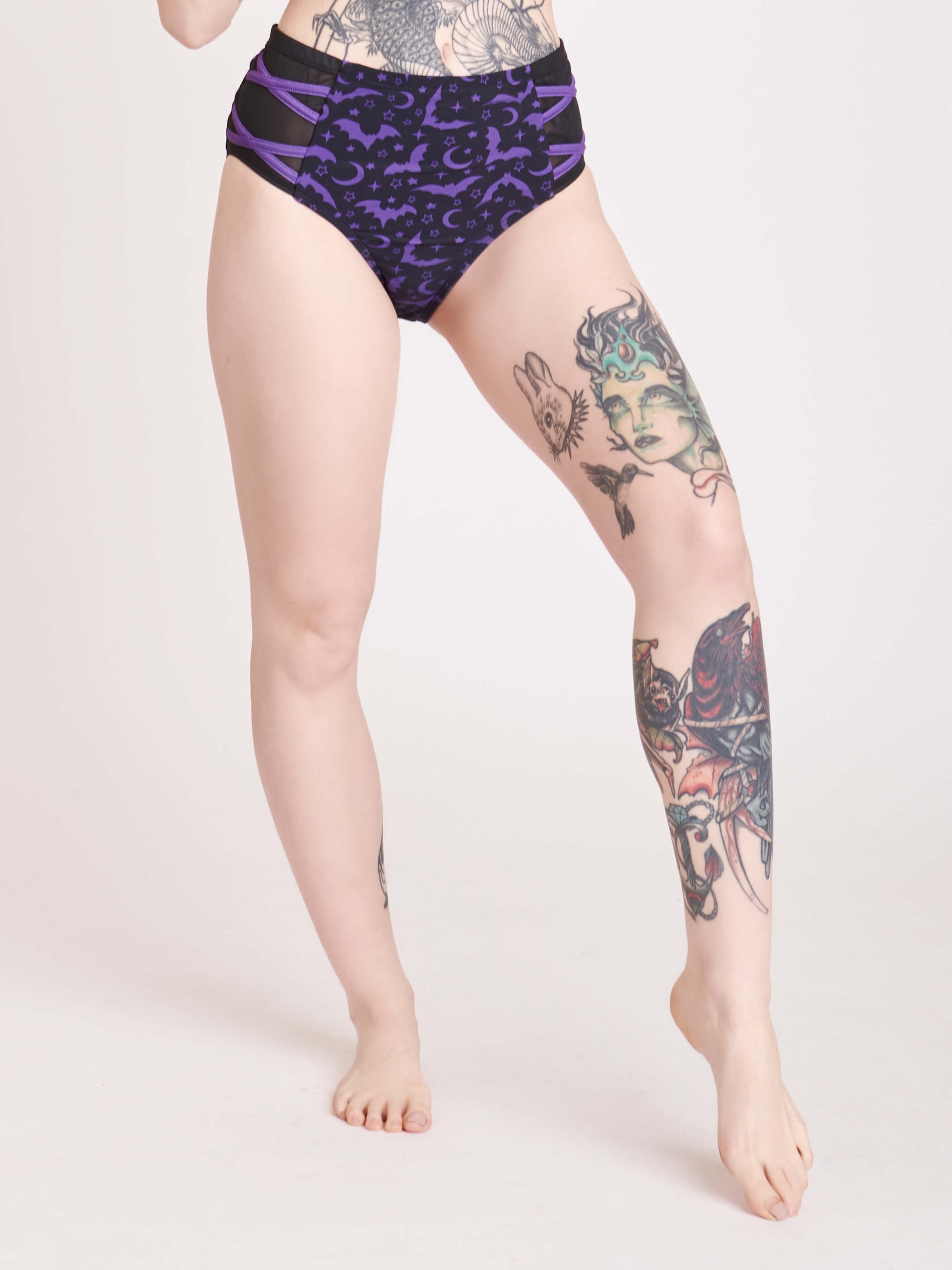 Black and purple bat print bikini bottoms with mesh side panell detail