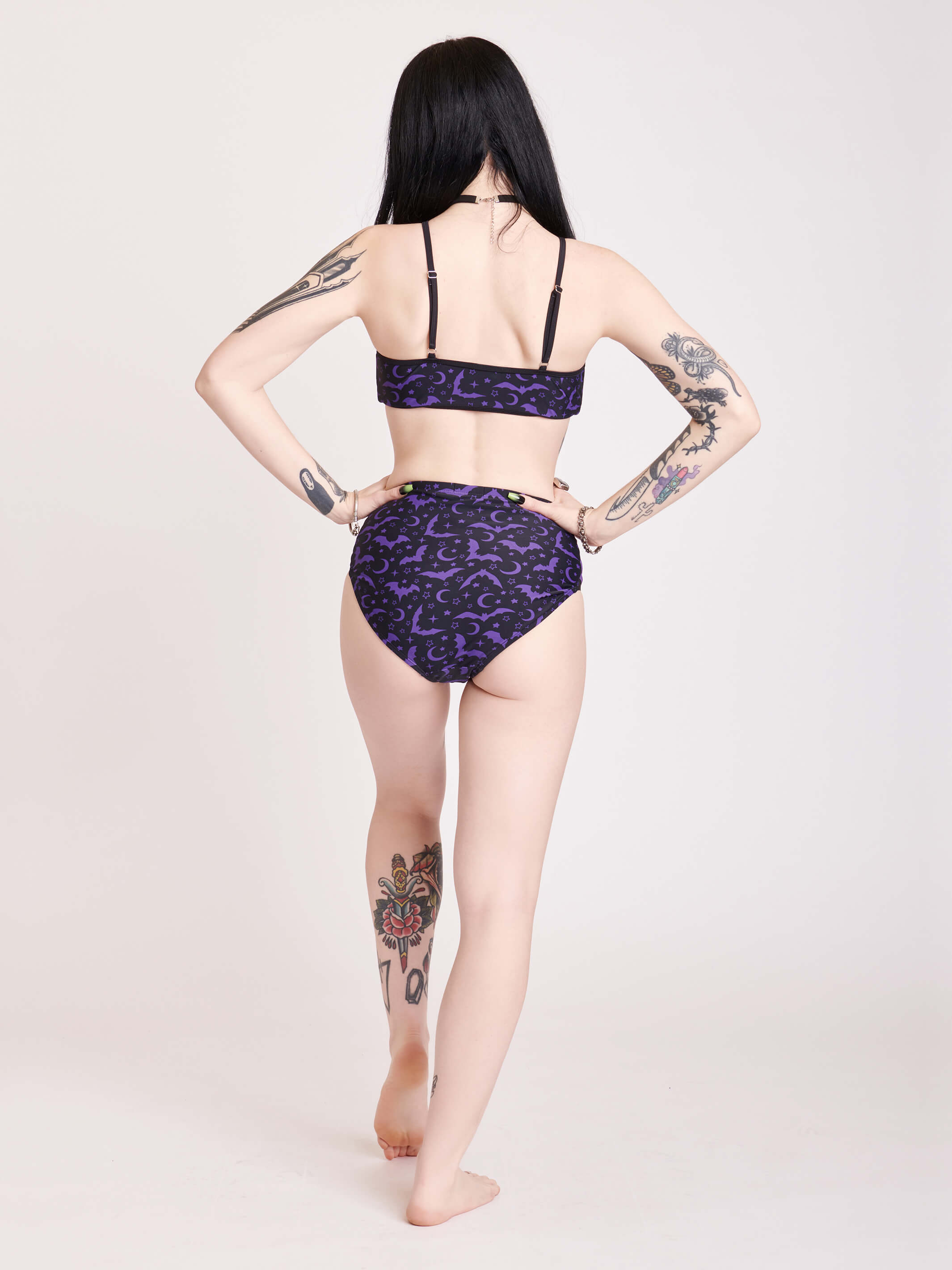 Black and purple bat print bikini bottoms with mesh side panell detail