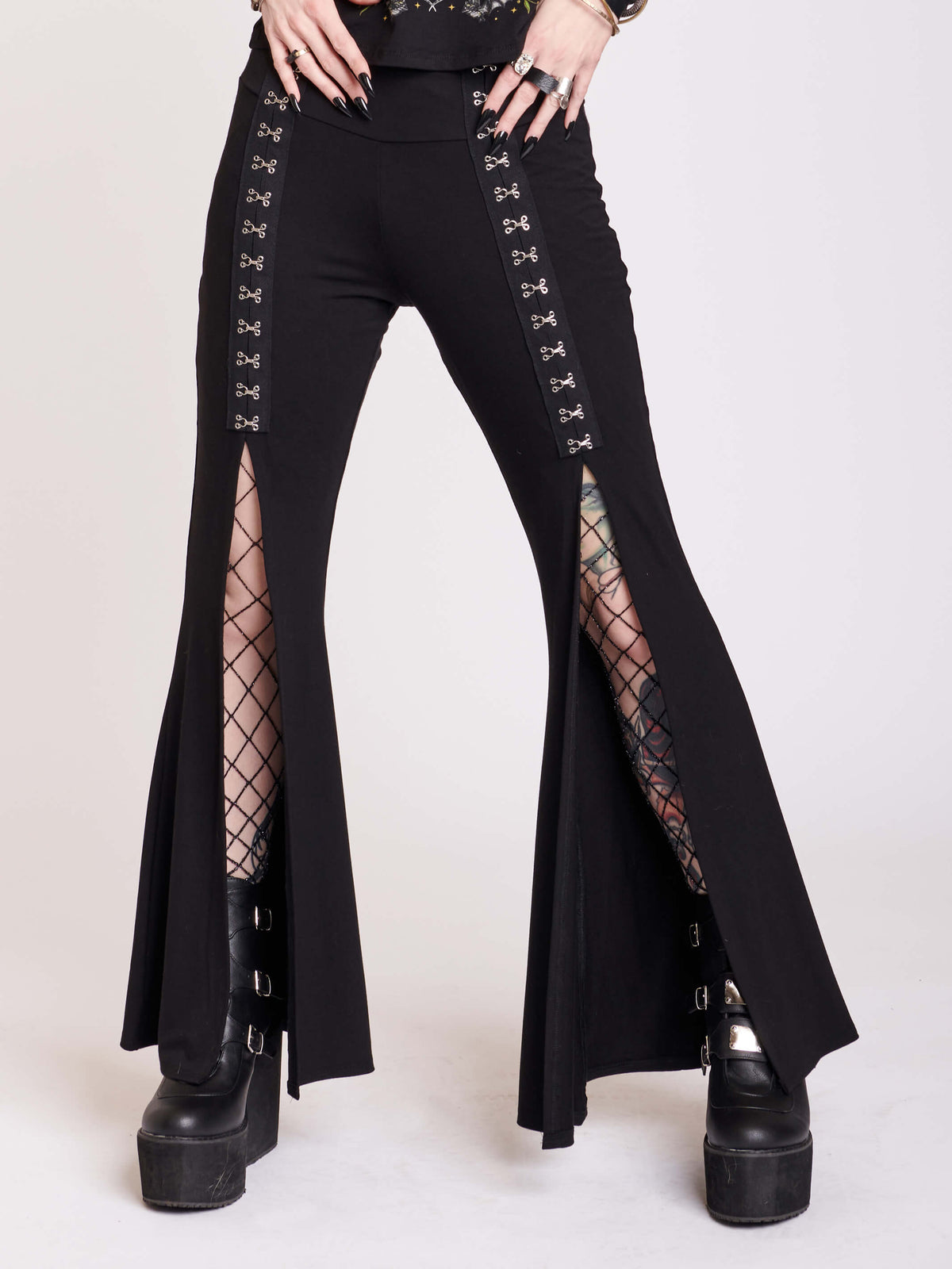 Black jersey palazzo pants with large hook and eye details and split center seam