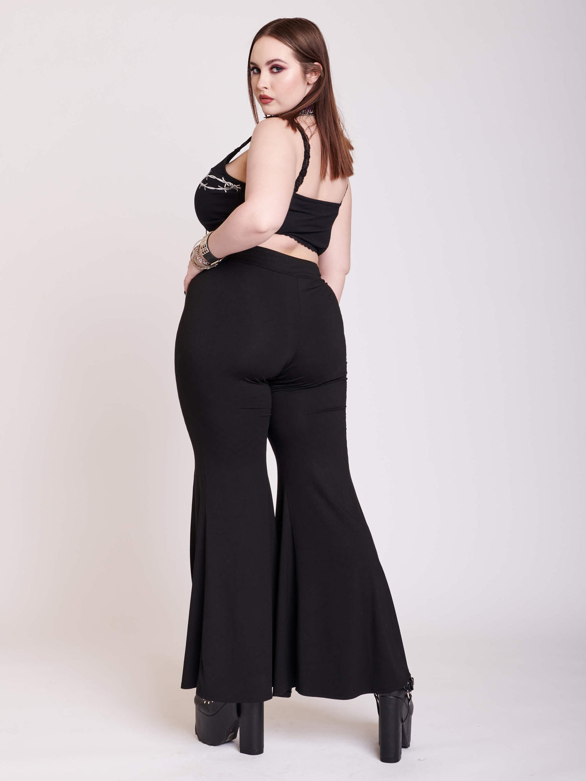 Black jersey palazzo pants with large hook and eye details and split center seam