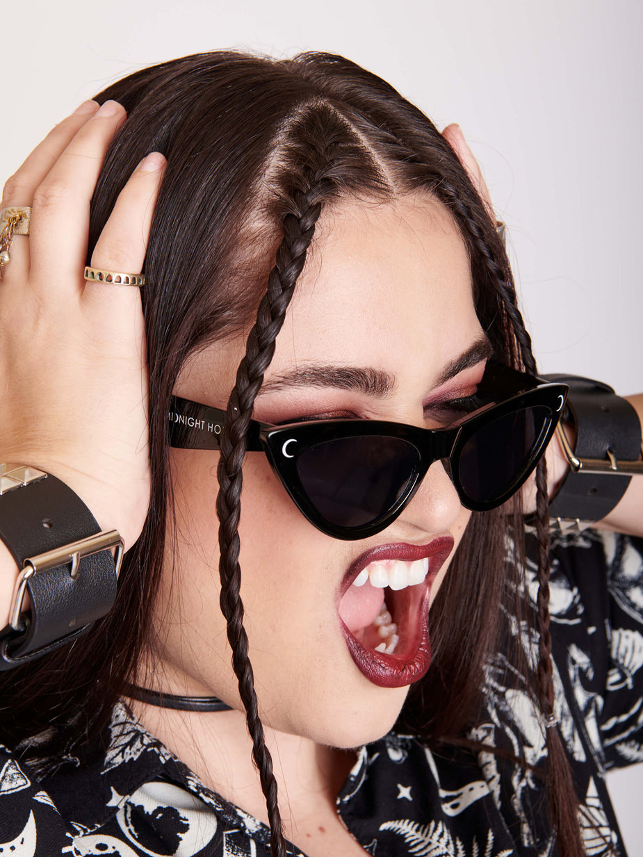 a woman with her hands on her head