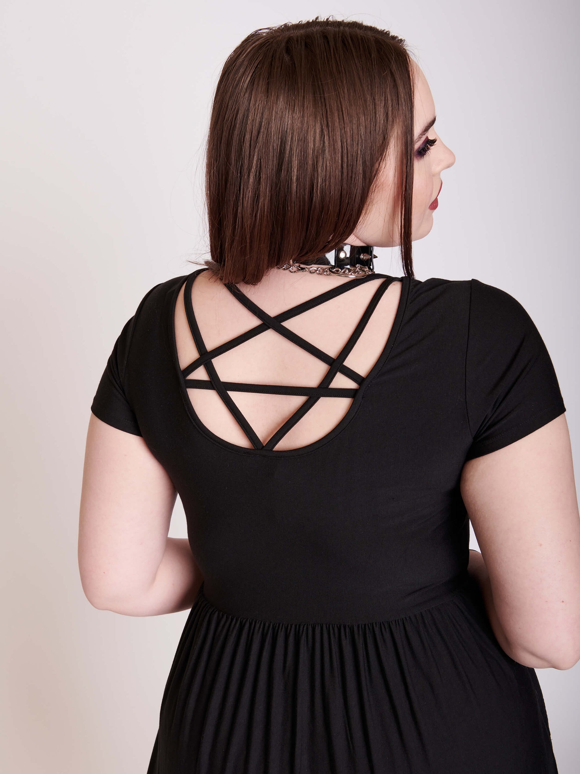 Black jersey skater dress with pentagram back strap details