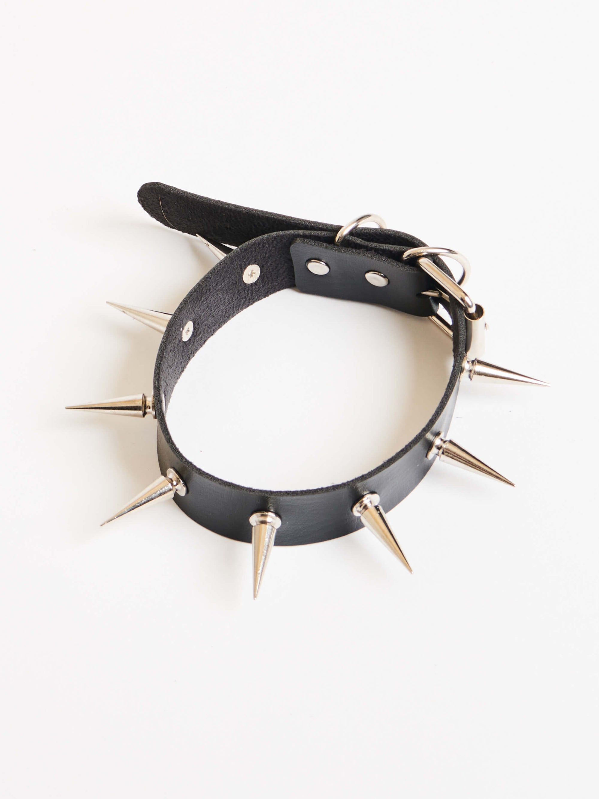 Super long metal spikes on adjustable vegan choker collar. 