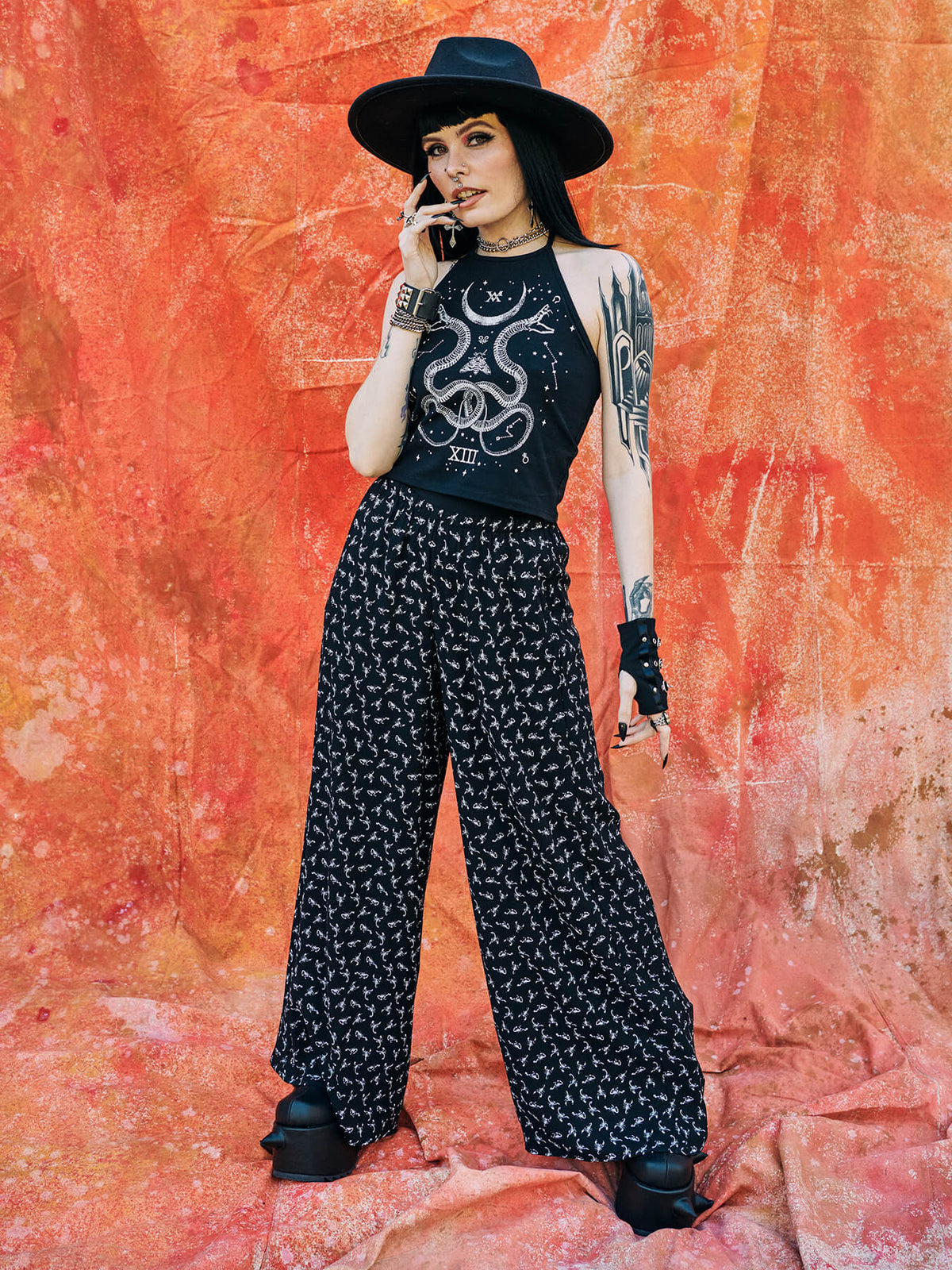 Black palazzo pants with all over scorpian print