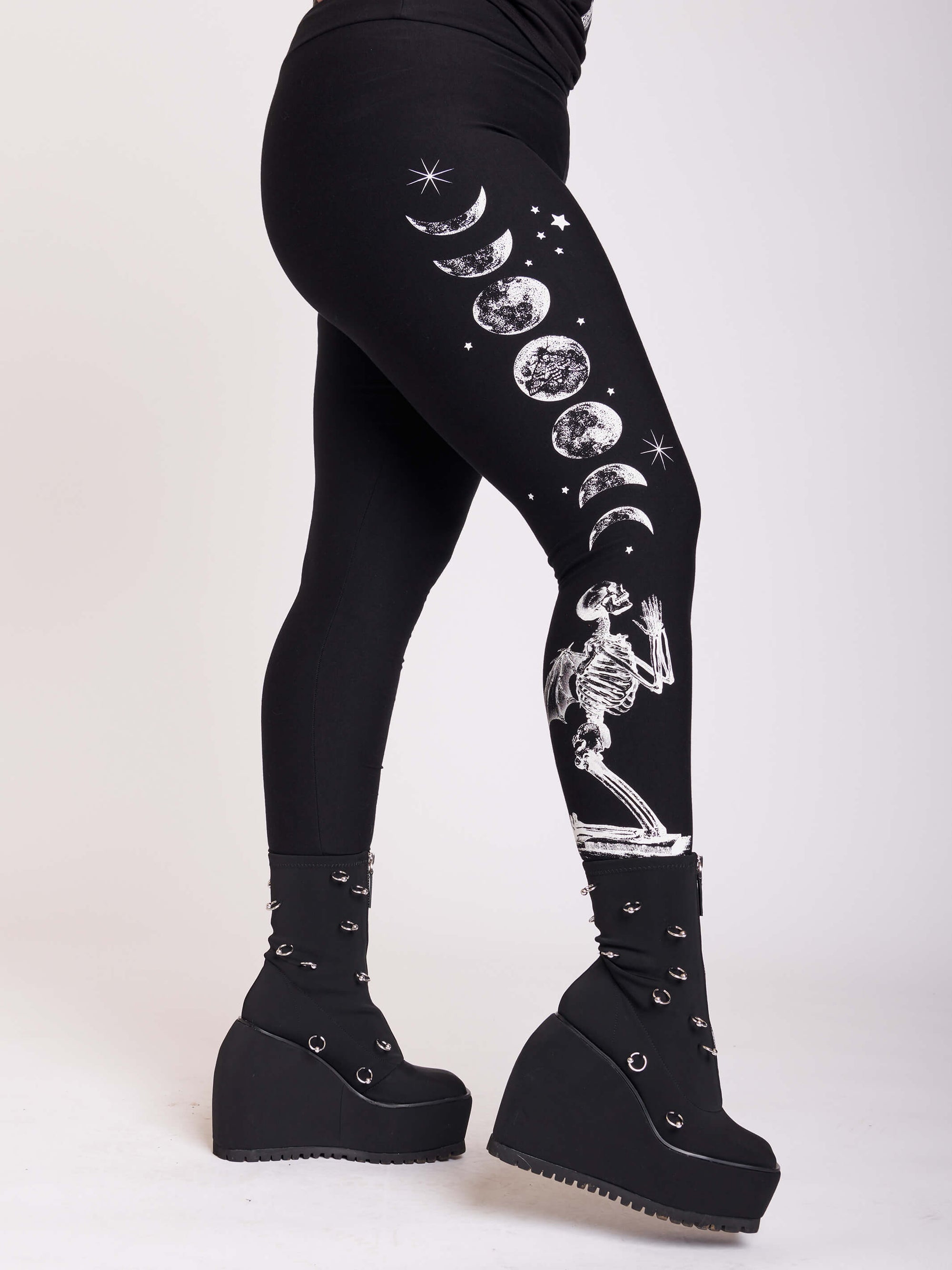 BLACK LEGGING WITH WHITE GRAPHIC FEATURING PRAYING SKELTON AND MOON PHASE