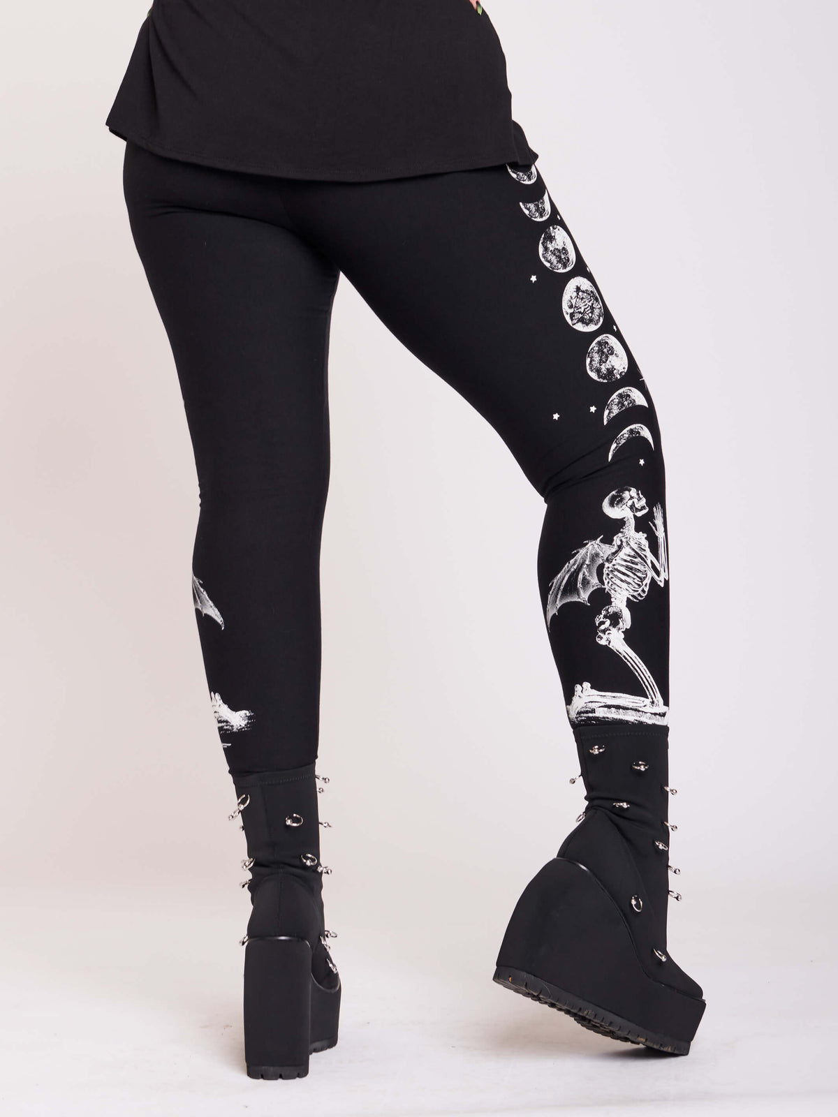 BLACK LEGGING WITH WHITE GRAPHIC FEATURING PRAYING SKELTON AND MOON PHASE