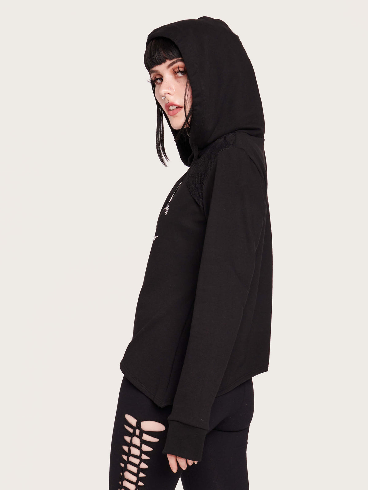 Be the hush of the night with this assymetrical hem, lace keyhole hoodie. Featuring our moon goddess sleeping bat graphic with black lace details. 100% cotton hoodie with nylon spandex lace details. witchy vibes, forest goth, bat, moon phase, crescent noon, pentacle, black lace, hoodie, nugoth, black goth, goth girl, bat girl. dark aesthetic, alt fashion.