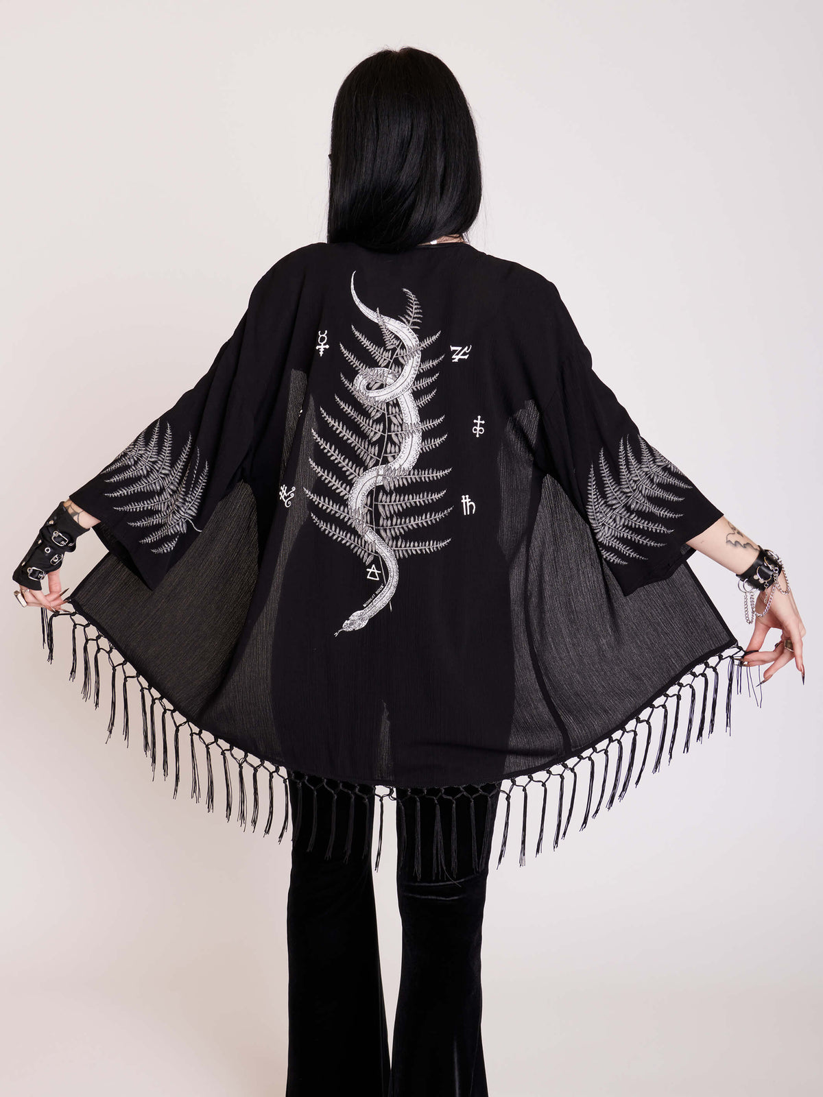 Slither through the forest in this 100% rayon challis kimono with rayon fringe hem.