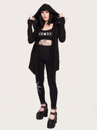Tap into some voodoo vibes with this embroidered spinal back detail on our french terry hooded cloak. Crescent moon & rose embroidery on the front. Assymetrical hem with pockets. Goth grunge fashion, alt girl fashion, goth clothing, summer goth, skull top, goth punk top, egirl fashion, emo fashion.