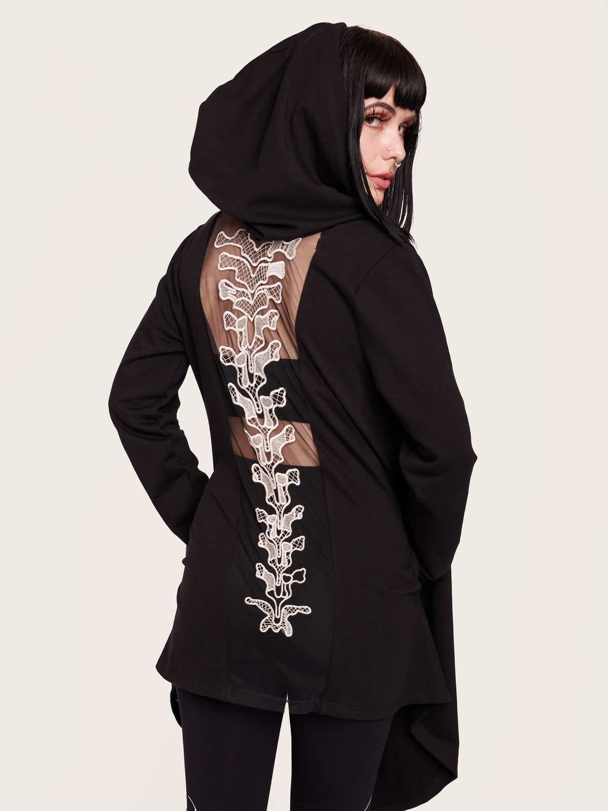 Tap into some voodoo vibes with this embroidered spinal back detail on our french terry hooded cloak. Crescent moon &amp; rose embroidery on the front. Assymetrical hem with pockets. Goth grunge fashion, alt girl fashion, goth clothing, summer goth, skull top, goth punk top, egirl fashion, emo fashion.