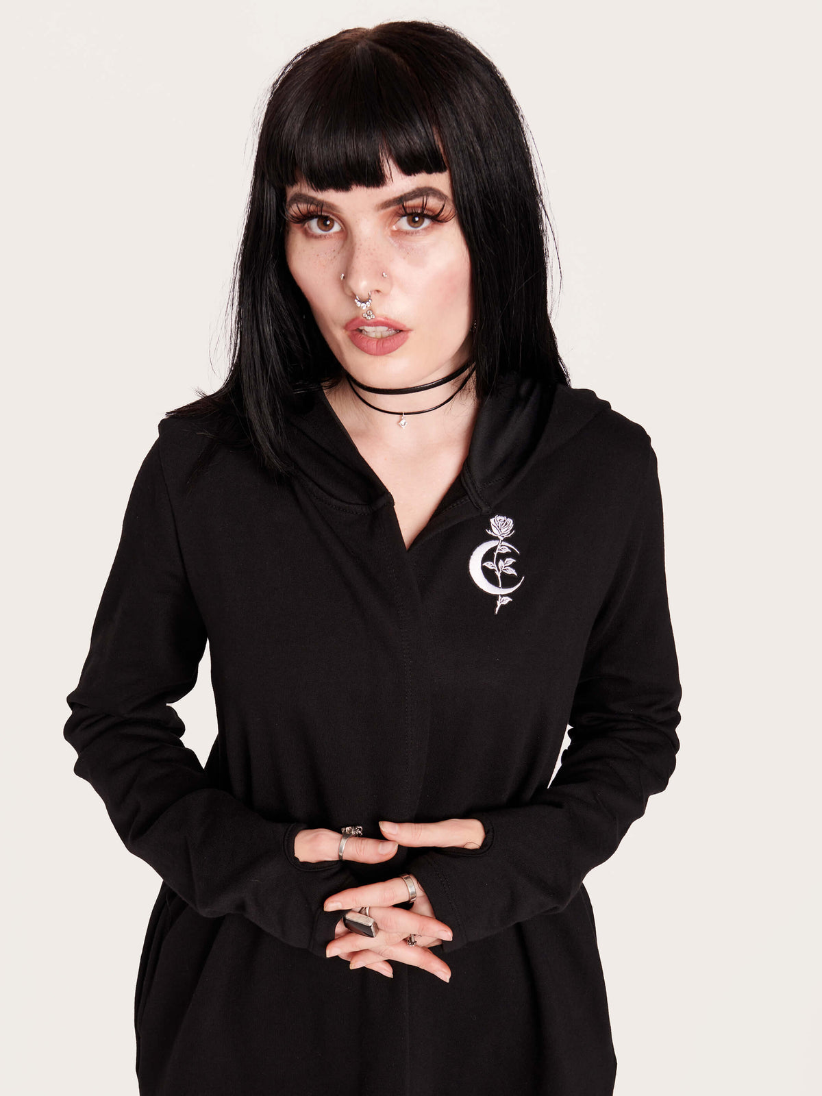 Tap into some voodoo vibes with this embroidered spinal back detail on our french terry hooded cloak. Crescent moon &amp; rose embroidery on the front. Assymetrical hem with pockets. Goth grunge fashion, alt girl fashion, goth clothing, summer goth, skull top, goth punk top, egirl fashion, emo fashion.