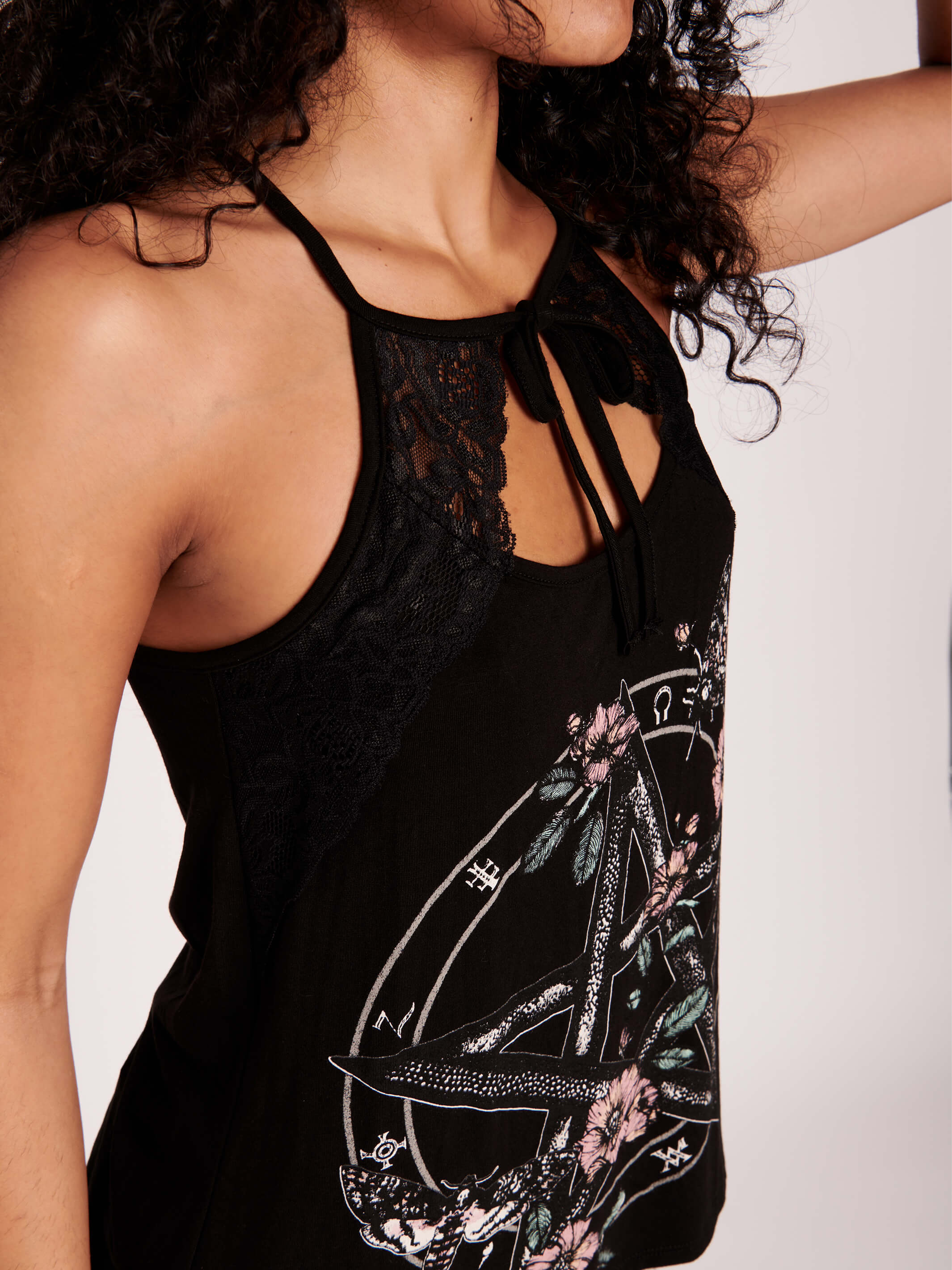 It's a hot goth girl summer in our pentacle witchy tank. Pastel floral, moths, and witchy symbols with victorian lace detailing. Black gothic tank top. Stand out from the masses with this beautifully crafted tank with black lace details..