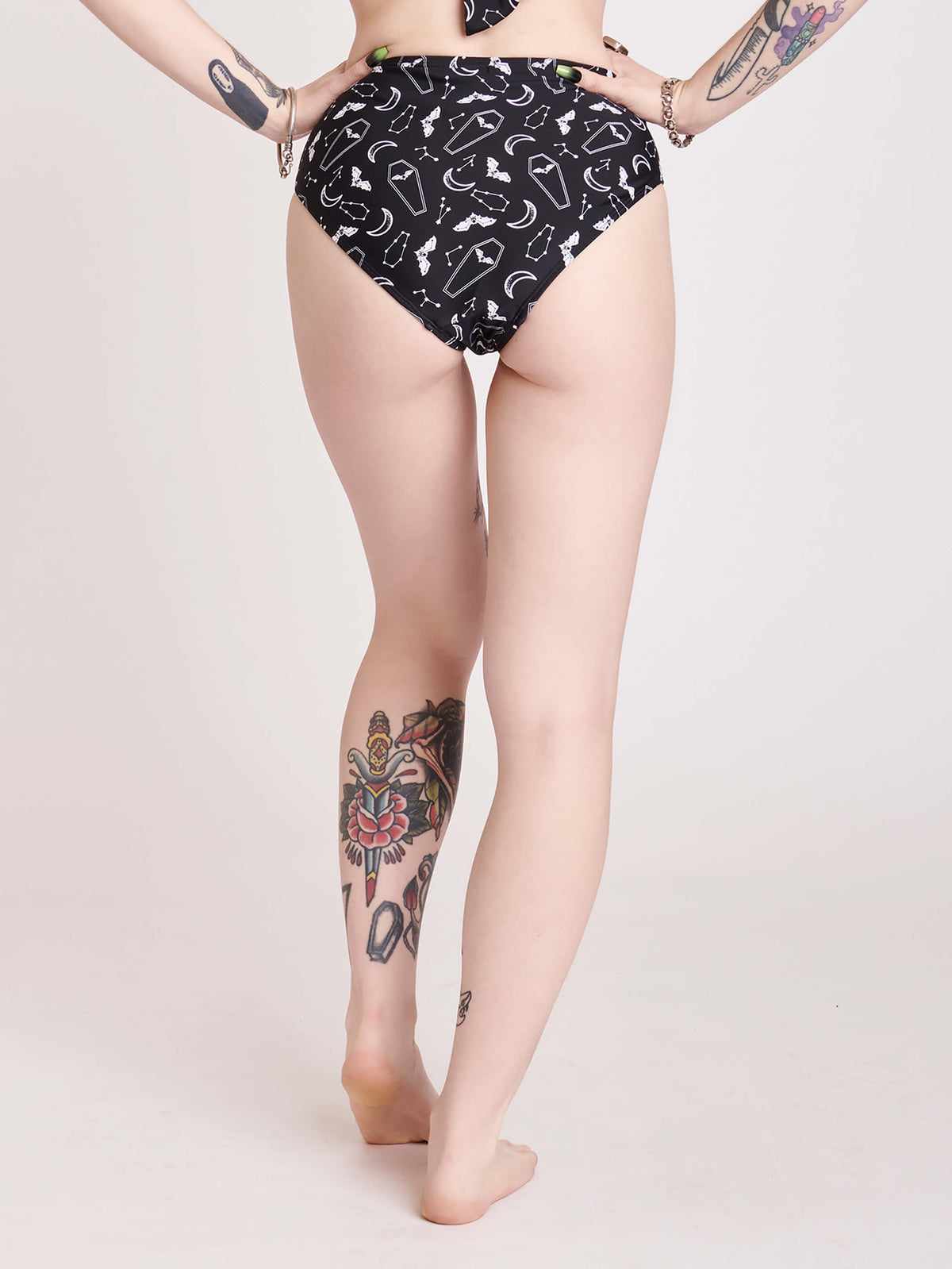 BLACK SWIM BOTTOMS WITH WHITE BATS AND COFFIN PRINT