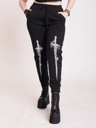 black joggers with dagger graphic