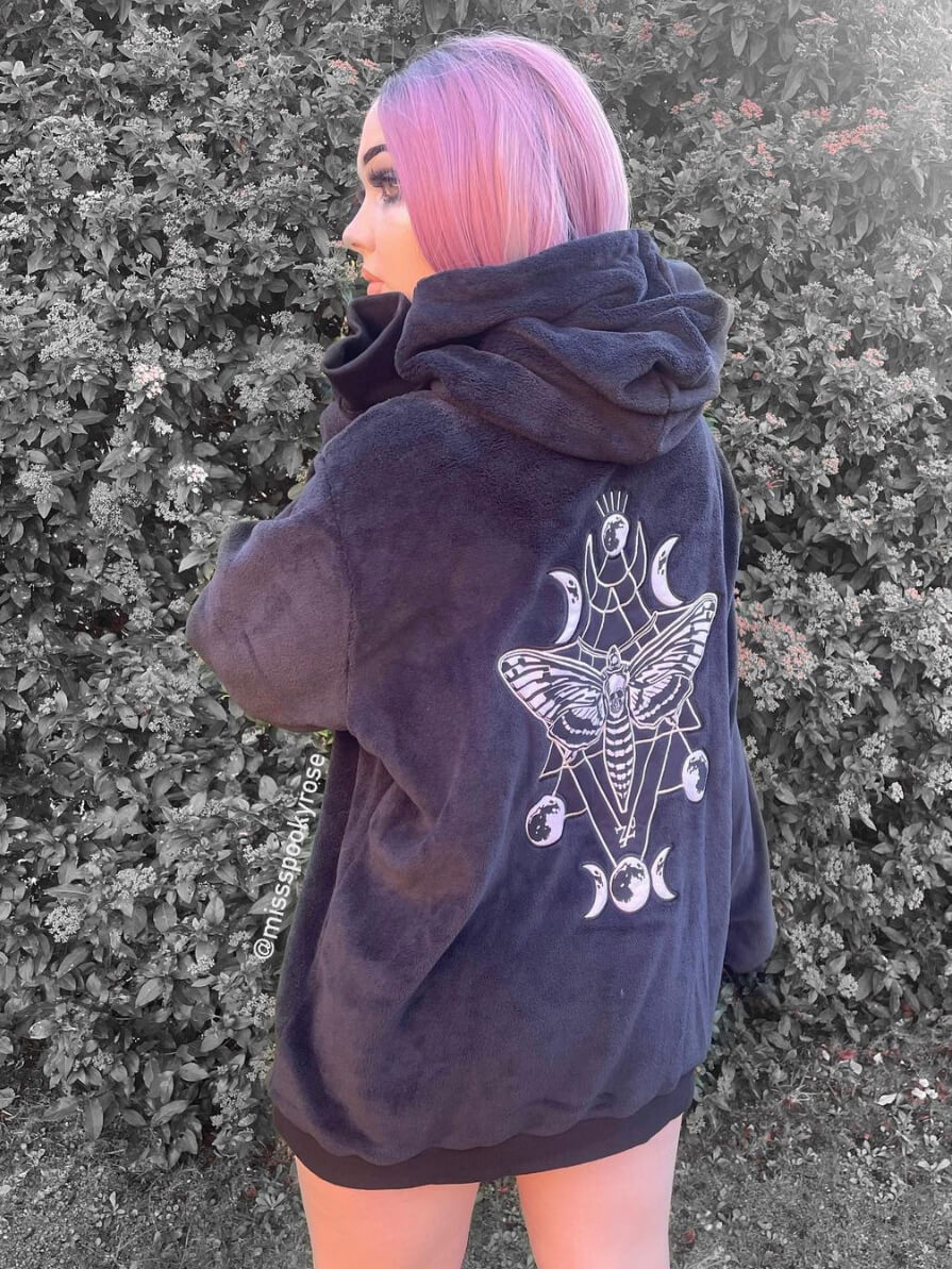 Plush black hoodie with large deathmoth patch on back