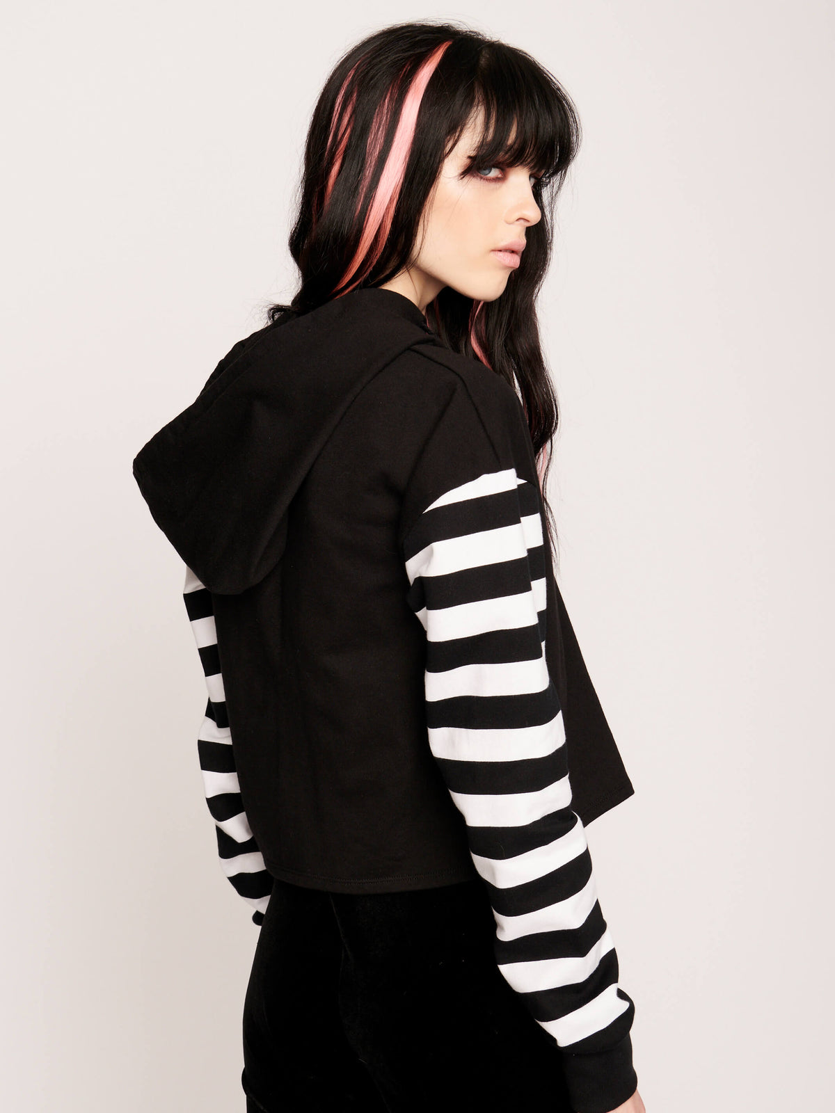 Cropped Midnight Hour logo hoodie with jail stripe sleeves.
