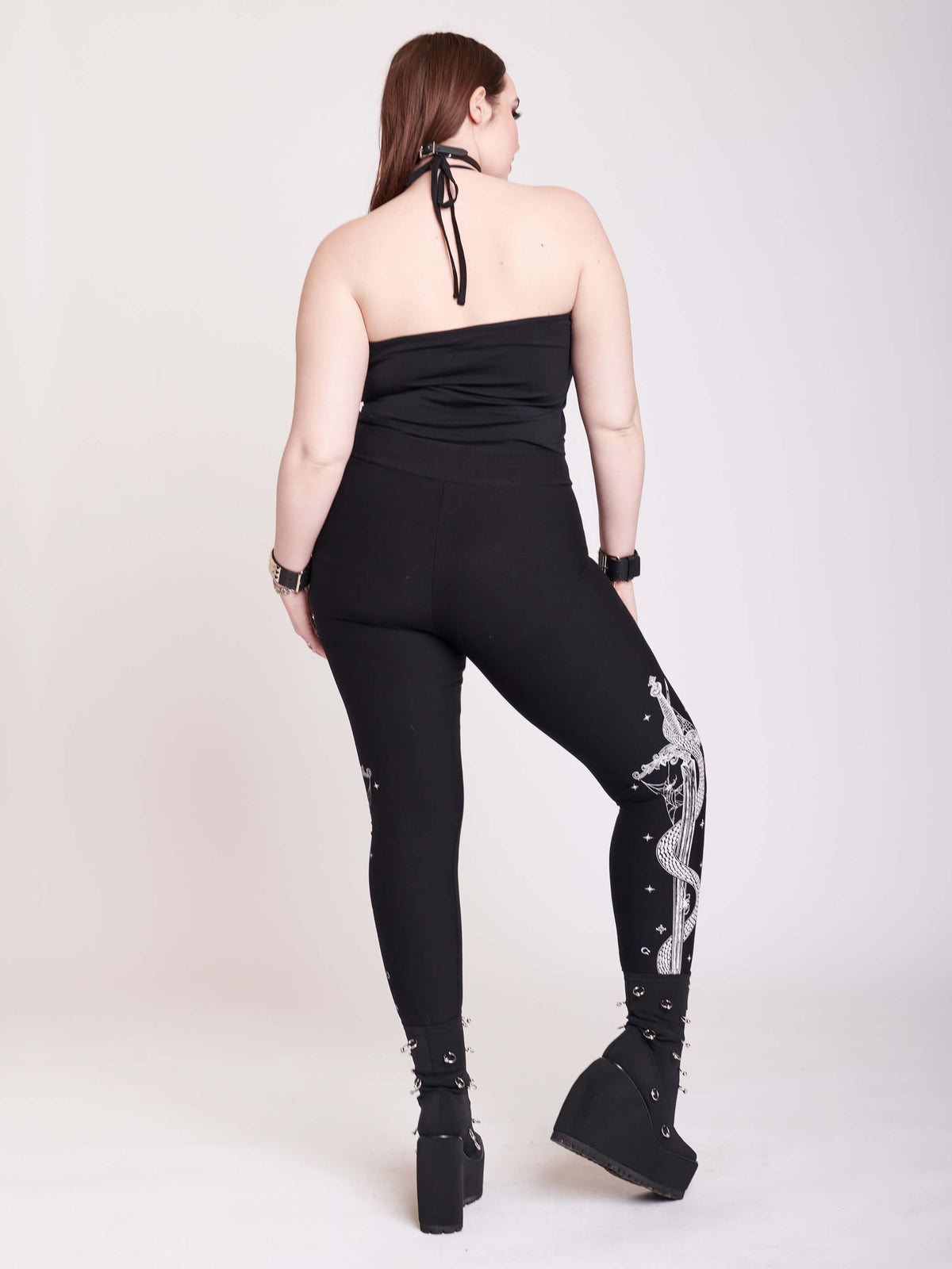 black legging with snake and dagger graphic on side