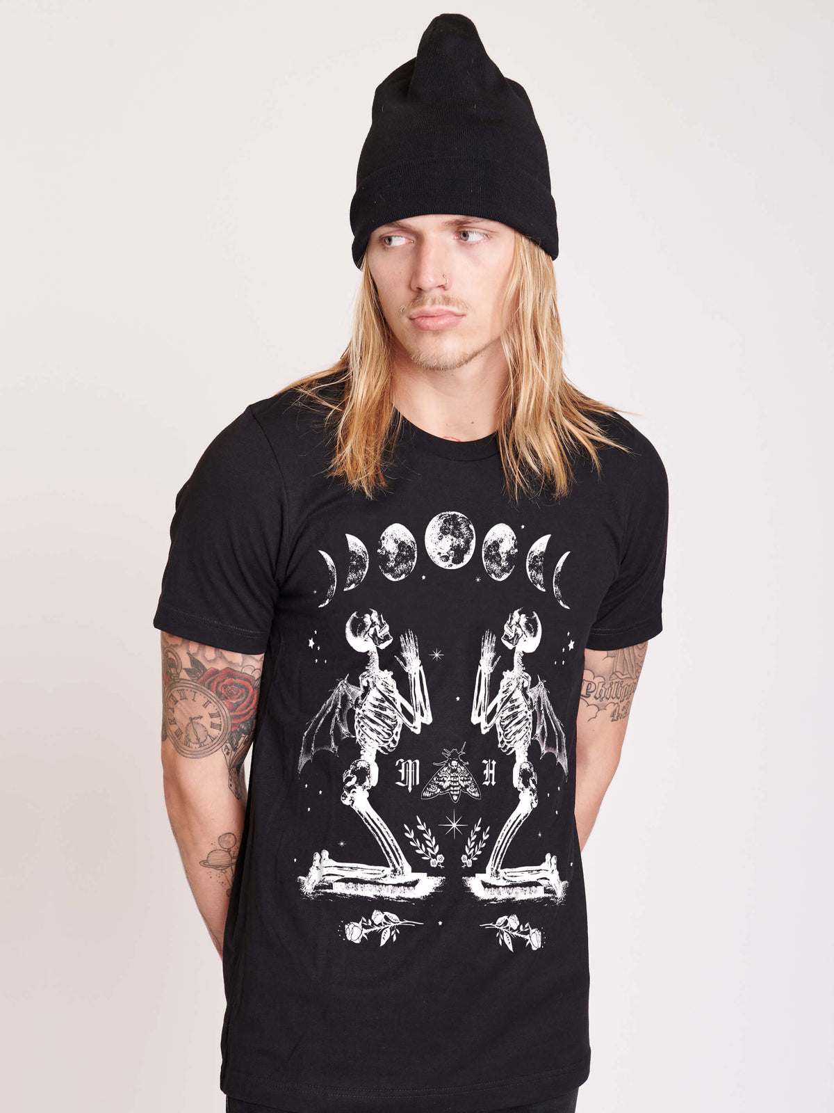 black t-shirt with moon phase and skeleton print.