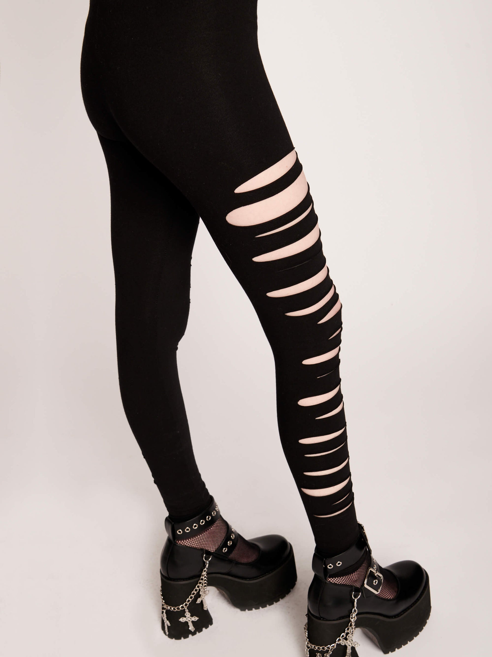 black leggings with shredded side detail