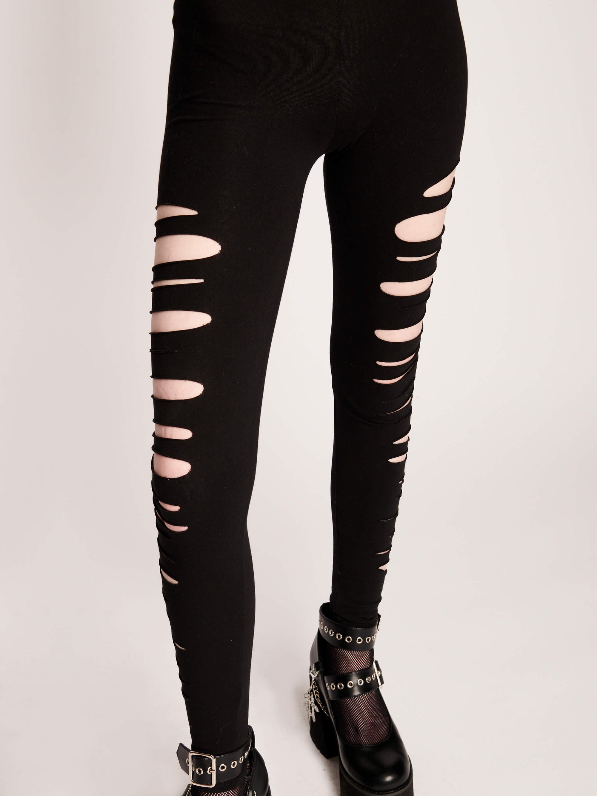 black leggings with shredded side detail